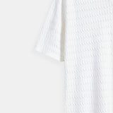 Polo en tricot blanc avec motif texturé