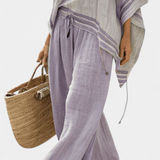 Serenella - épaules nues et pantalons à jambes larges rayés