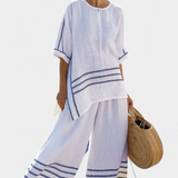 Vittorina – top asymétrique à rayures sophistiqué et pantalons audacieux