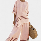 Vittorina – top asymétrique à rayures sophistiqué et pantalons audacieux