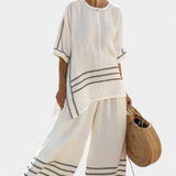 Vittorina – top asymétrique à rayures sophistiqué et pantalons audacieux