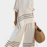 Vittorina – top asymétrique à rayures sophistiqué et pantalons audacieux