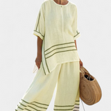 Vittorina – top asymétrique à rayures sophistiqué et pantalons audacieux