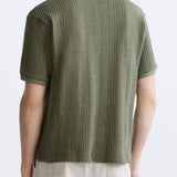Polo structuré en tricot avec fermeture éclair