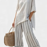 Fiorella – blouse asymétrique élégante et pantalons rayés